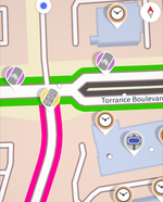 Street Map with icons indicating need for bicycle, street name, and other information, with some streets highlighted in green, gray or magenta.